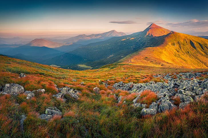 A sunrise over a vast mountain range, illustrating the spiritual lift, clarity, and hope that Meridian Magazine seeks to offer readers each day through Restoration-centered content.