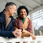 Couple smiling and talking together outdoors, representing finding a spouse through faith, emotional risk, and intentional dating for Latter-day Saint singles.