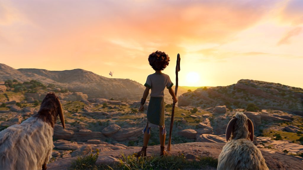 Young David stands with his sheep in the Judean wilderness at sunset in David, symbolizing his calling, humility, and early relationship with God.