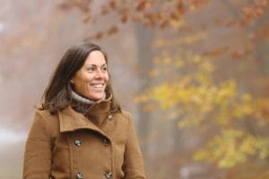 Single Latter-day Saint woman walking thoughtfully outdoors, representing discipleship and covenant faith during a season of singleness.