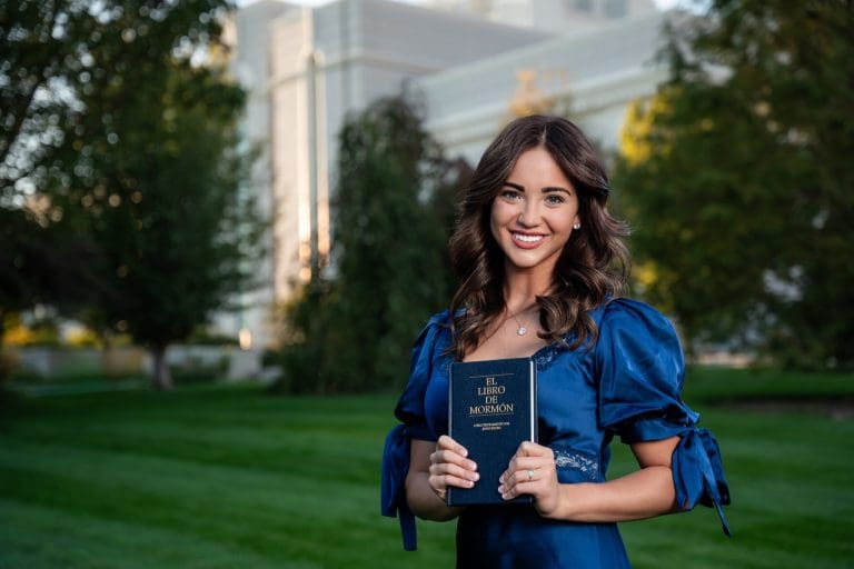 Missionary, Jocelyn Osmond, holding Book of Mormon symbolizing Here Am I, Hineni, and answering God’s call
