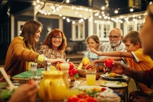 Family sharing a meal together illustrating the Love-Share-Invite pattern that builds unity, trust, and eternal family relationships.