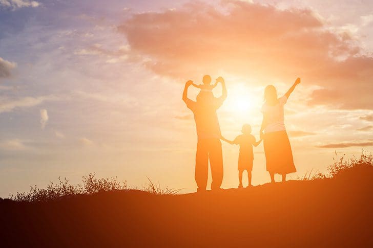 A family united at sunrise representing Zion, unity, and becoming pure in heart as taught in Moses 7 and the Come Follow Me podcast.