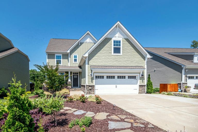 A newly built family home illustrating the challenges of trying to build a custom house while navigating house plans, compromise, and marriage.
