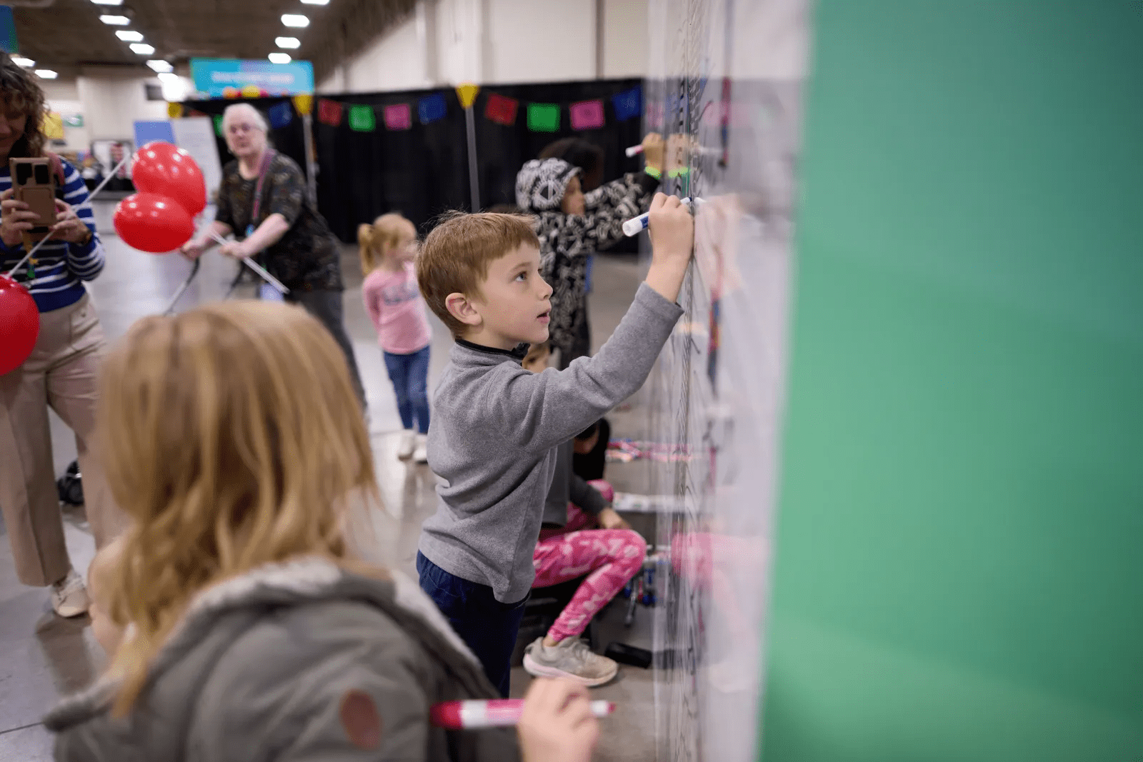 Children enjoy an interactive family history activity during RootsTech 2026 Family Discovery Day in Salt Lake City, a free FamilySearch event for families.