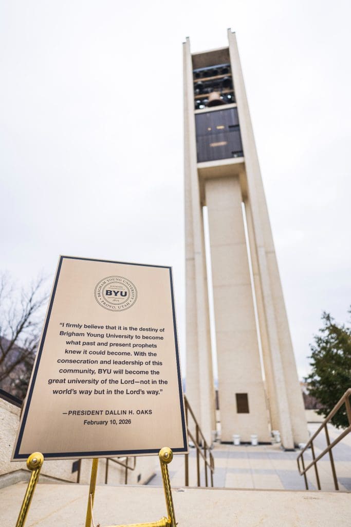 A commemorative plaque featuring a quote from President Dallin H. Oaks’ February 10, 2026 devotional stands at the base of the BYU Carillon Bell Tower, reinforcing the university’s mission and prophetic vision.