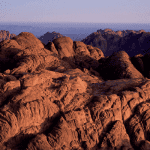 Desert mountains representing the land of Canaan where Abraham received God’s covenant and priesthood blessings in Genesis and the Book of Abraham.