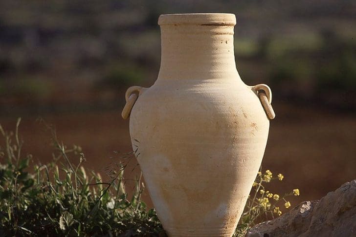 Clay water jar representing Rebekah at the well in Genesis 24, Old Testament covenant blessings story of Isaac and Rebekah.