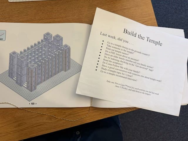 Lego Salt Lake Temple build with “Build the Temple” sign encouraging Ward Family participation in Temple work.