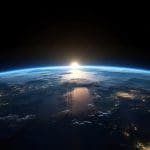 Creation revealed through Genesis, the Book of Moses, and the Book of Abraham as the earth is shown at dawn from space.