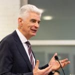 Elder Gérald Caussé speaks at a Paris devotional about Church growth in France and the surge of baptisms.