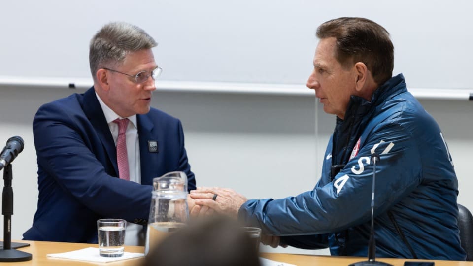 Bishop Sean Douglas of the Presiding Bishopric speaks with an Olympic official during a media event in Milan focused on the Utah 2034 Olympic Games partnership.