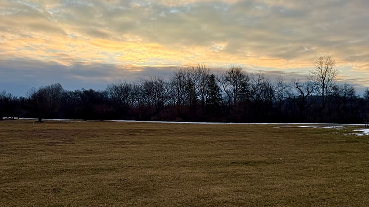 A wide winter field under dramatic skies reflects the emotional and physical terrain explored in the Joseph Smith documentary series.