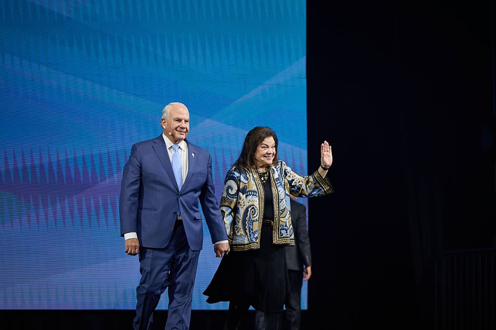 Elder Ronald A. Rasband and Melanie Rasband at RootsTech 2026 discussing family history, temple work, and creating a legacy of faith that strengthens family across generations.