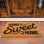 Home Sweet Home welcome mat representing the work of a homemaker creating family traditions and a welcoming home