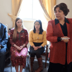 Woman teaching Sunday School in a Latter-day Saint ward following General Handbook update allowing women to serve as Sunday School president.