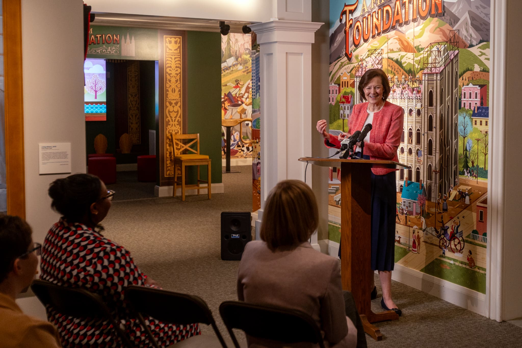 A speaker presents at the Church History Museum’s Salt Lake Temple exhibit, highlighting its purpose to teach children about temple history and faith.