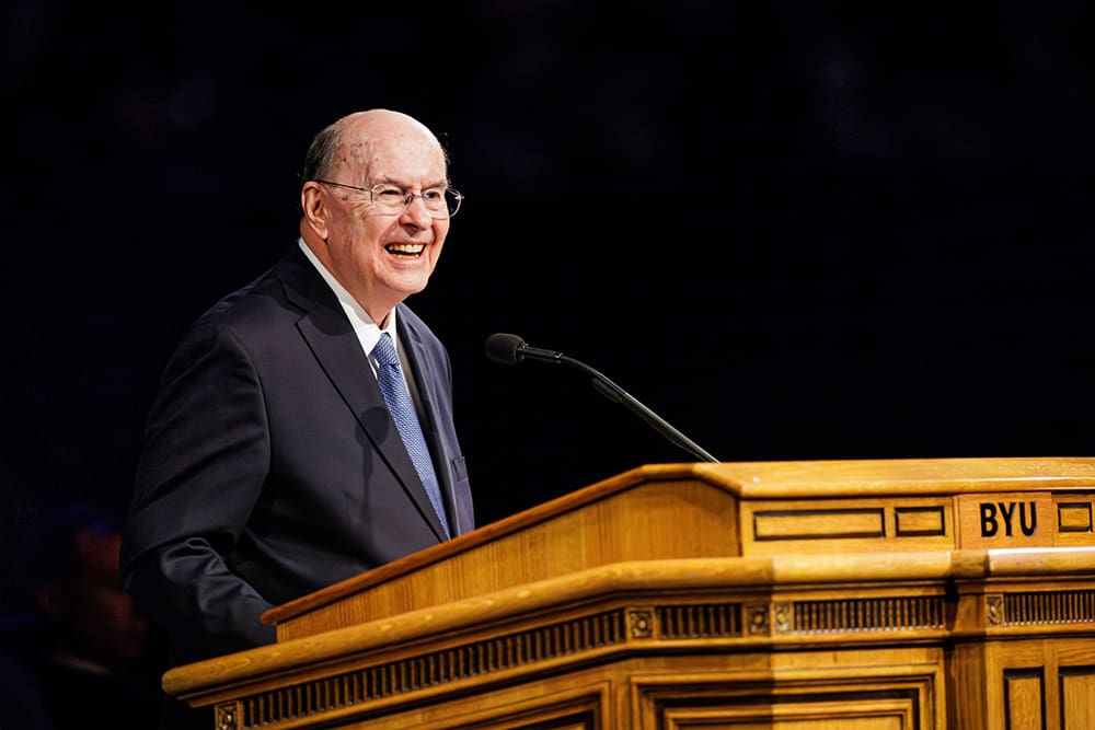 Elder Quentin L. Cook speaking at a BYU devotional about faith, technology, and the artificial intelligence age