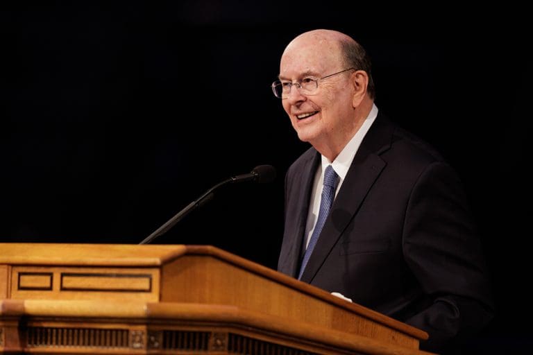 Elder Quentin L. Cook speaking at a Brigham Young University devotional about faith, technology, and the artificial intelligence age.