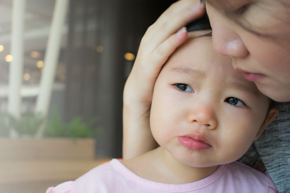mother comforting sad child showing compassion in parenting and understanding children