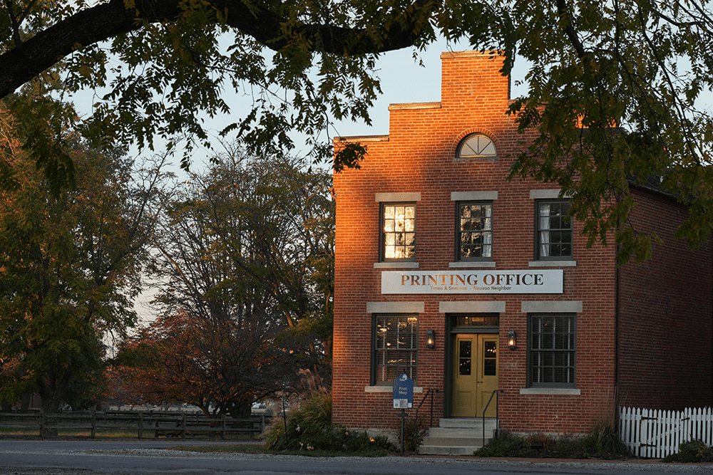 Historic printing office building in Nauvoo Illinois near sites tied to Joseph Smith, the Nauvoo Temple, and early Latter-day Saint history.