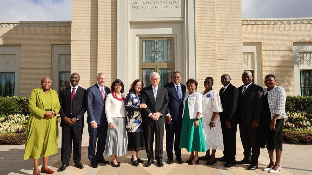 Elder Gerrit W. Gong and fellow leaders pose with the Harare Zimbabwe Temple presidency and their wives at the temple dedication ceremony.