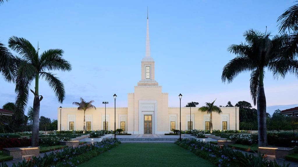 Exterior view of the Harare Zimbabwe Temple of The Church of Jesus Christ of Latter-day Saints at dusk, dedicated March 1, 2026.