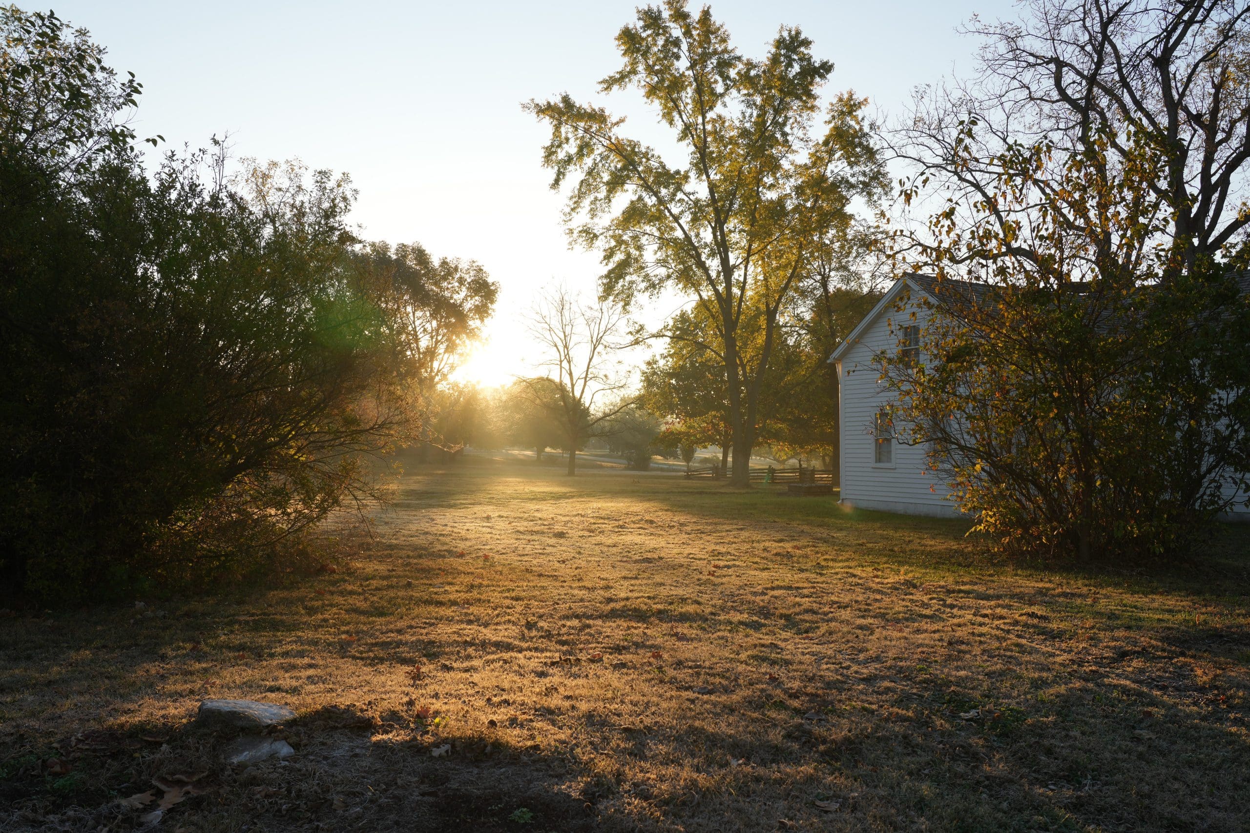 Morning sunlight across historic Nauvoo Illinois near restored homes and fields that recall the once thriving nineteenth-century Latter-day Saint city.