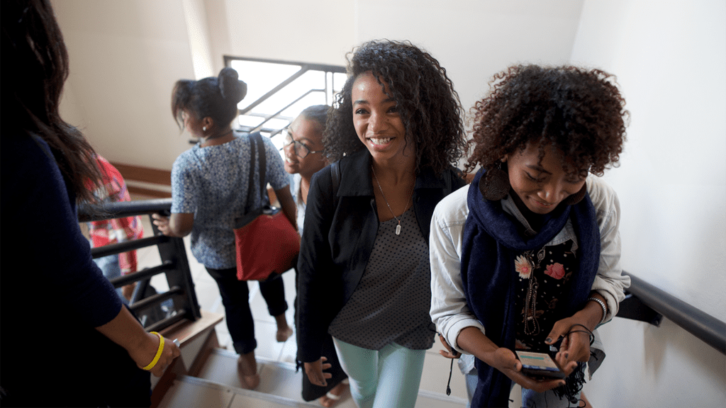 Young adults gather and connect in a Church setting, representing the social and spiritual benefits of Institute classes.