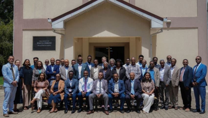 A group of NGO representatives gathers outside a Church building in Addis Ababa, Ethiopia, during a collaborative humanitarian meeting featured in Church news April 2026.