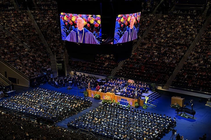 BYU graduates gather at commencement in the Marriott Center, reflecting Church news April 2026 reporting that 91% strengthened faith in Jesus Christ.
