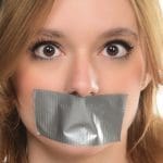 woman with mouth taped shut symbolizing therapy free speech restrictions Chiles v. Salazar Supreme Court counseling speech rights