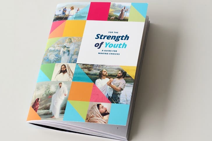  Close-up of the updated For the Strength of Youth guide used in the new youth curriculum 2026 initiative.
