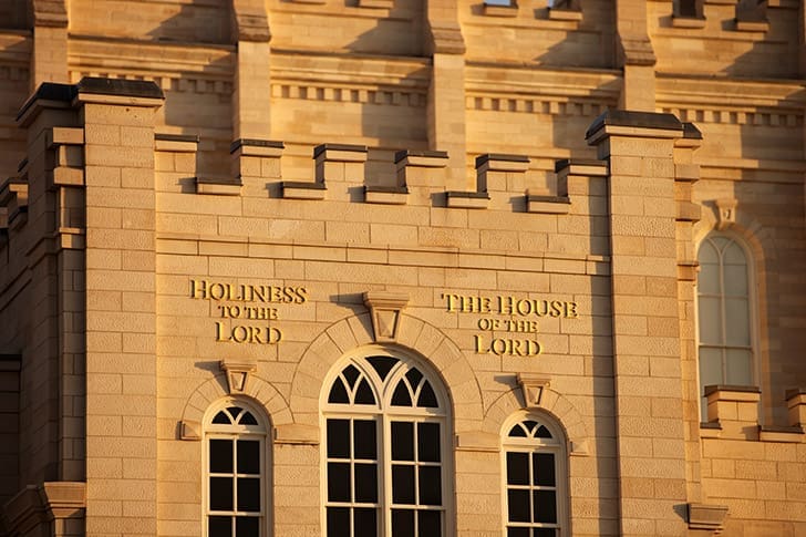 Temple exterior with the inscription “Holiness to the Lord – The House of the Lord,” reflecting sacred purpose in temple worship and Church teaching