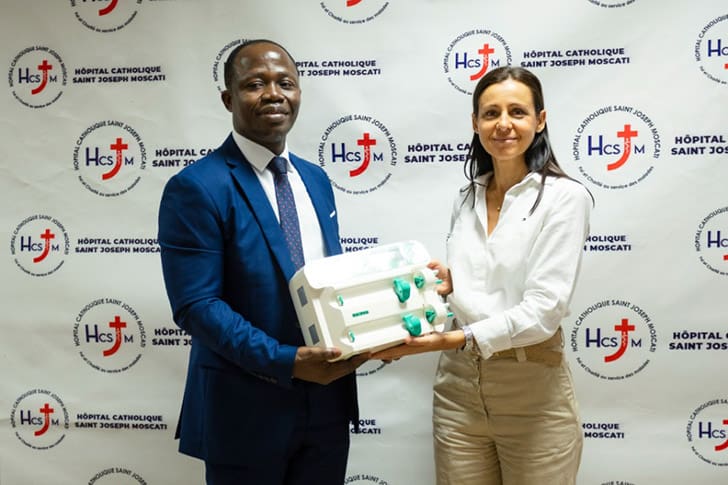 Church representatives present medical equipment to a hospital in Côte d’Ivoire as part of humanitarian aid in Africa.