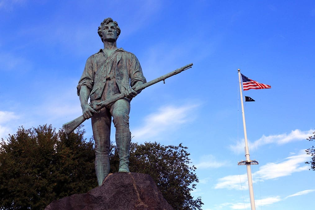 The Minute Man statue in Lexington, symbolizing the Revolutionary War, a key stop on the Church History tour highlighting early American history and gospel beginnings.