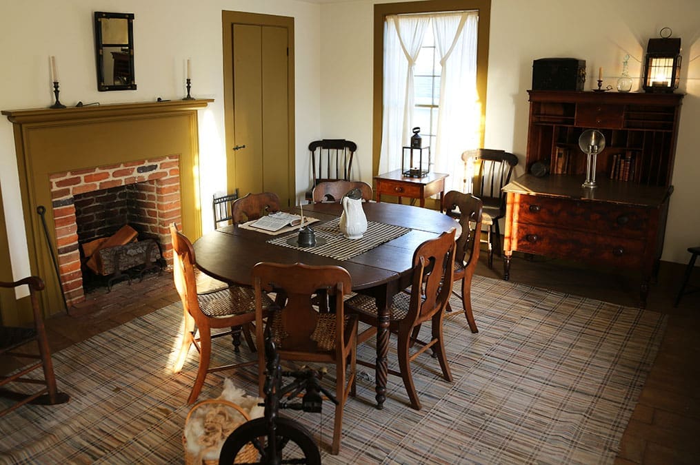 A restored 19th-century interior of the upper room of the Newel K. Whitney Store in Kirtland, offering Church History Tour participants insight into daily life during the Restoration.
