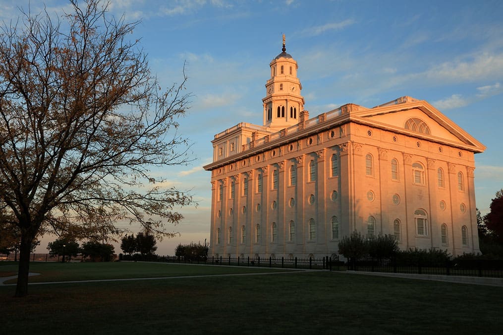 The Nauvoo Temple illuminated by warm evening light, a central highlight of the Church History Tour and a sacred symbol of the Restoration and Joseph Smith’s legacy.