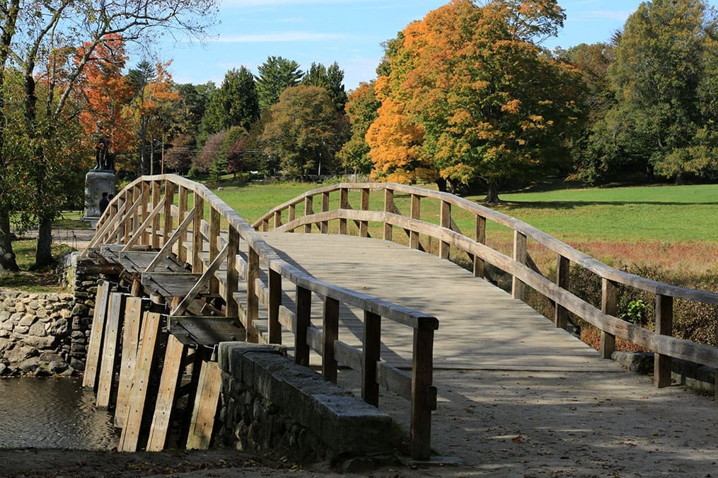 Historic Old North Bridge in Concord, a peaceful autumn scene where Church History tour visitors explore early Church history and foundational American events.