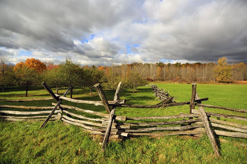 A rustic split-rail fence stretches across the New England field of Joseph Sr. Lucy Smith's farmstead that you'll see during the Church History Tour and the beginnings of Joseph Smith’s life.
