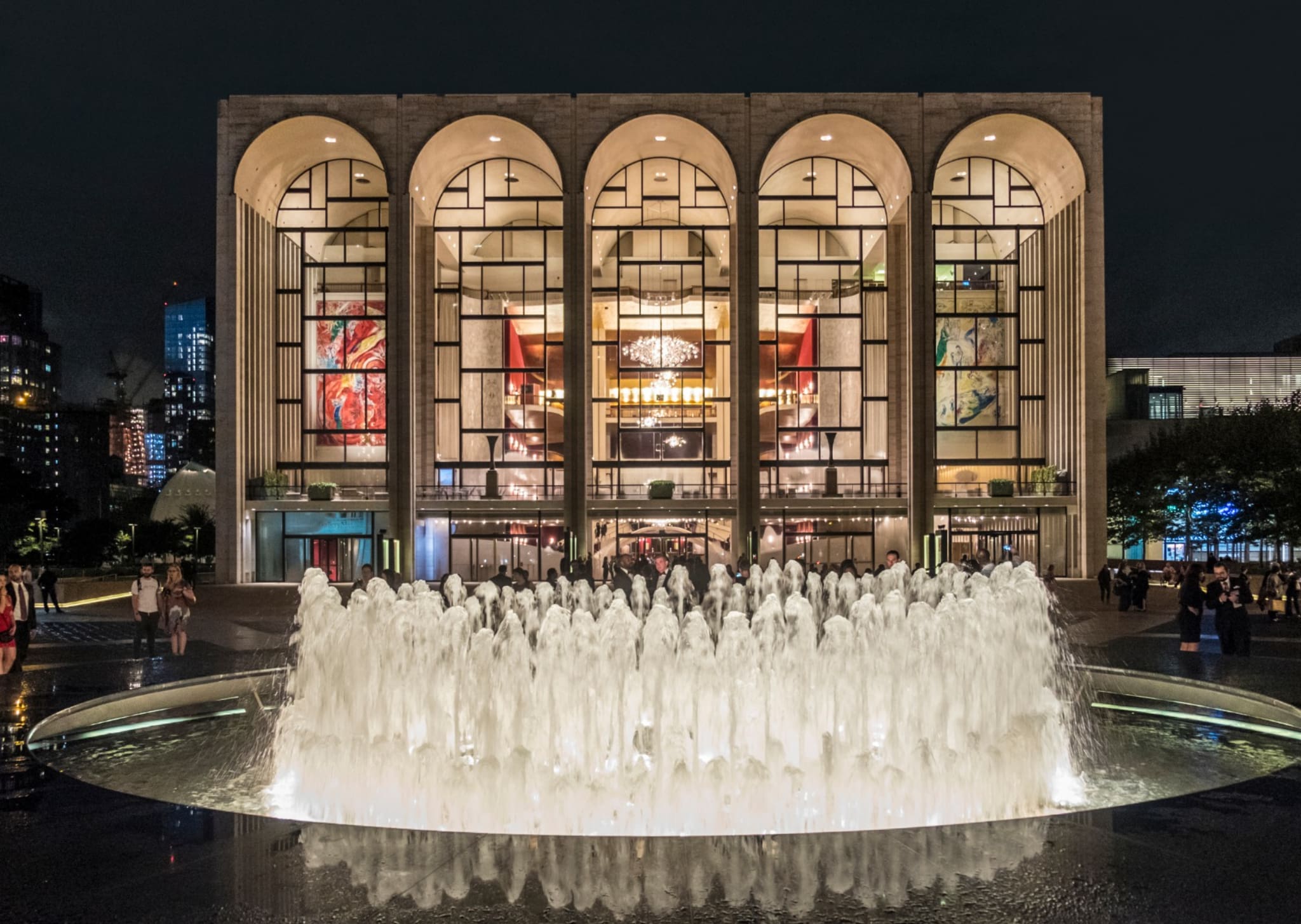 The illuminated Metropolitan Opera House at Lincoln Center in New York City, where Lamb of God was performed with BYU Singers and world-class musicians.