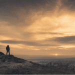 Silhouette overlooking the horizon symbolizing faith and deliverance in the Book of Judges and Jesus Christ
