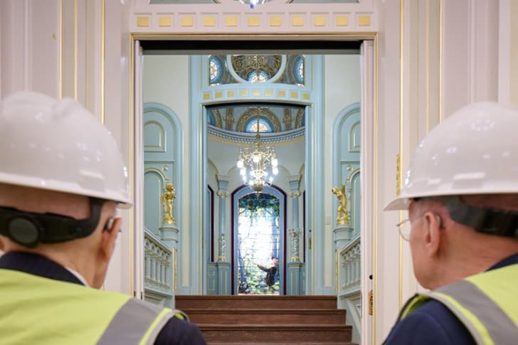 Church leaders in hard hats view the beautifully restored interior of the Salt Lake Temple during a special First Presidency tour as renovations near completion.