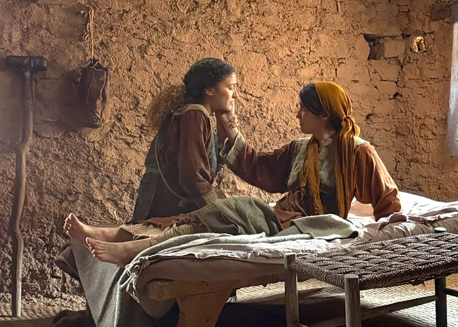 Talia cares for her sick mother in an emotional scene from the Parables Project adaptation of the Parable of the Ten Virgins, emphasizing faith, sacrifice, family devotion, and perseverance.