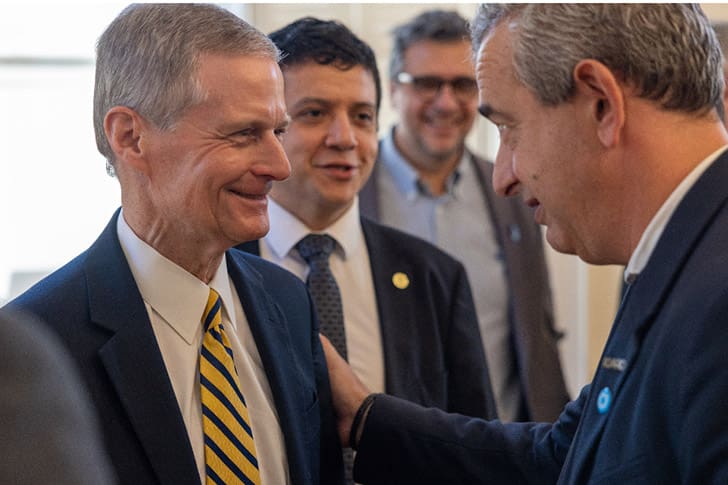 Elder David A. Bednar meets with civic leaders in Argentina to discuss the future temple planned for Rosario, reflecting ongoing Apostolic Ministry and temple growth.