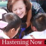 Camille N. Johnson greets children during a humanitarian outreach visit featured in Hastening Now Church of Jesus Christ of Latter-day Saints news update