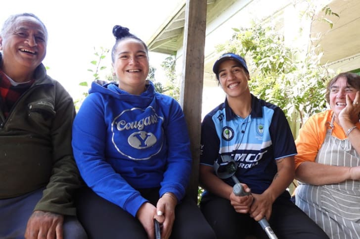 Latter-day Saint boxing champion Lani Daniels sits with family members in New Zealand after publicly expressing gratitude to Heavenly Father following her title victory.