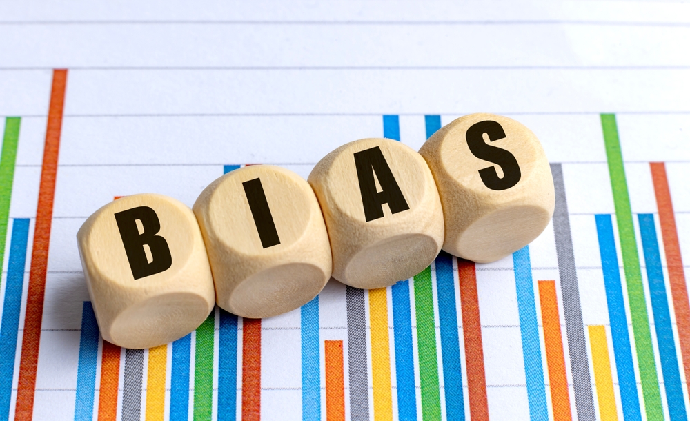 A graphic illustrating the concept of bias highlights one of the central concerns discussed in the Currents article: whether AI Models accurately represent religious beliefs or exhibit Religious Bias in AI when addressing faith, conversion, and ethical questions.