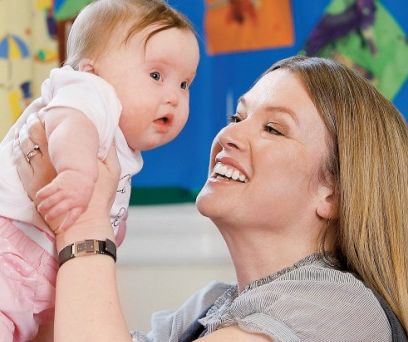 happy_mom_holding_up_baby