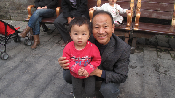 Grandpa taking care of grandchild